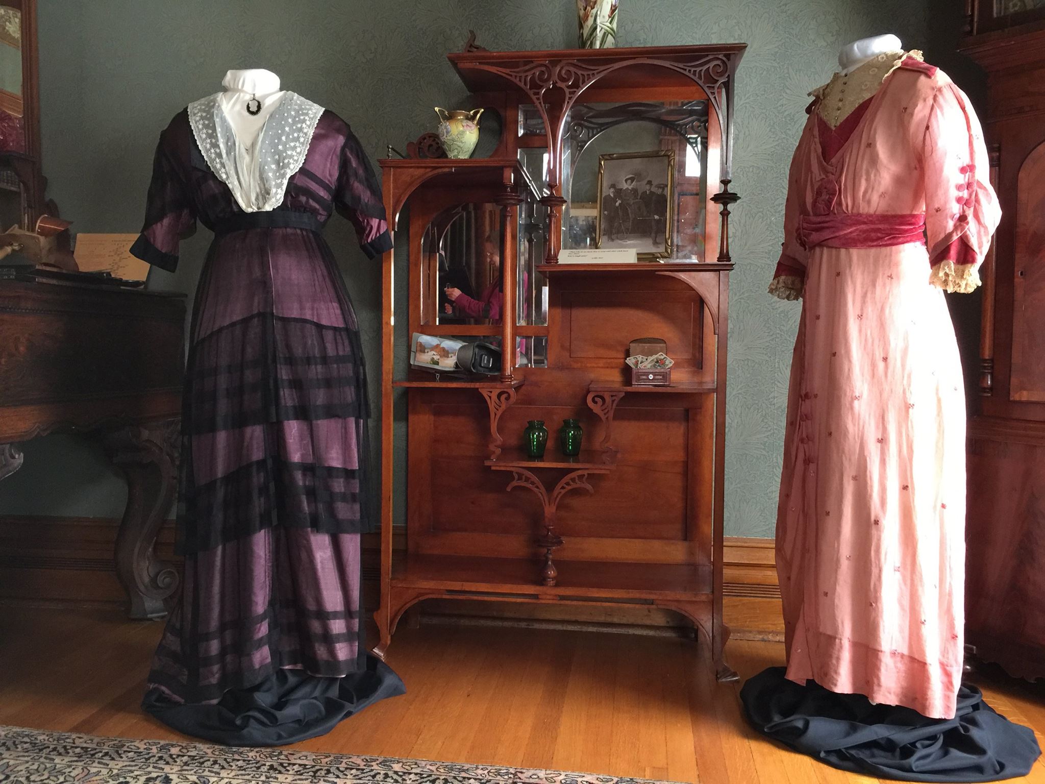 The Margaret Brown Collection demonstrates the bold steps women's fashion took between 1910 and 1920: The ankle was gradually revealed as hemlines rose and the decade progressed. High waistlines, draping, and asymmetry were hallmarks of the day. At the beginning of the decade, hobble skirts were the new, provocative rage -- slim skirts that literally hobbled their wearers, forcing them to take small, mincing steps. The rose-colored gown (r.) is a good example of draping and a moderate hobble skirt.