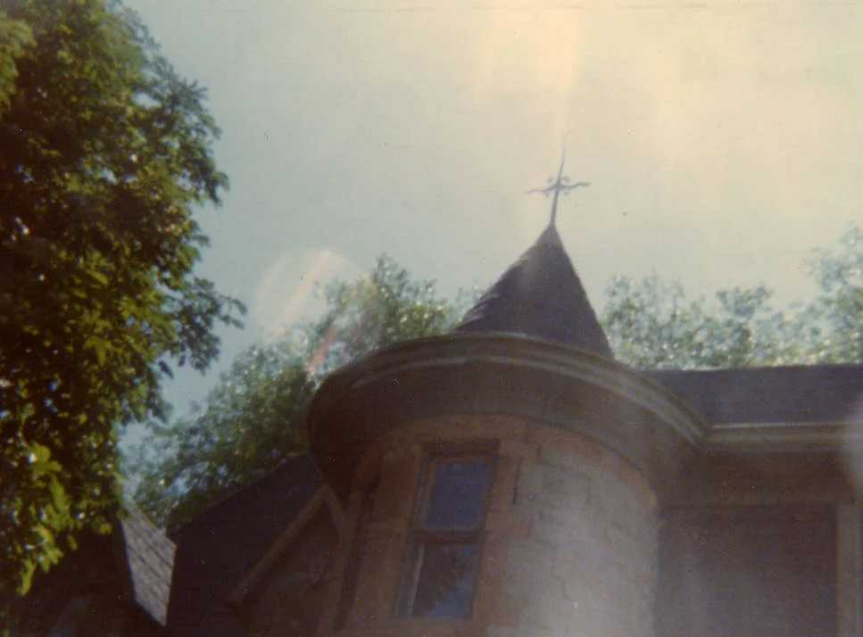 1976 - Color photograph of the east side of the Avery house located at 328 West Mountain Avenue; Fort Collins, Colorado. This photograph was taken during the dedication of the house.
