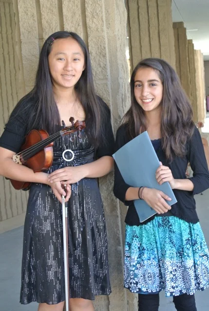  Julia and Ava getting ready to perform for Julia's Certificate of Merit Evaluation. 