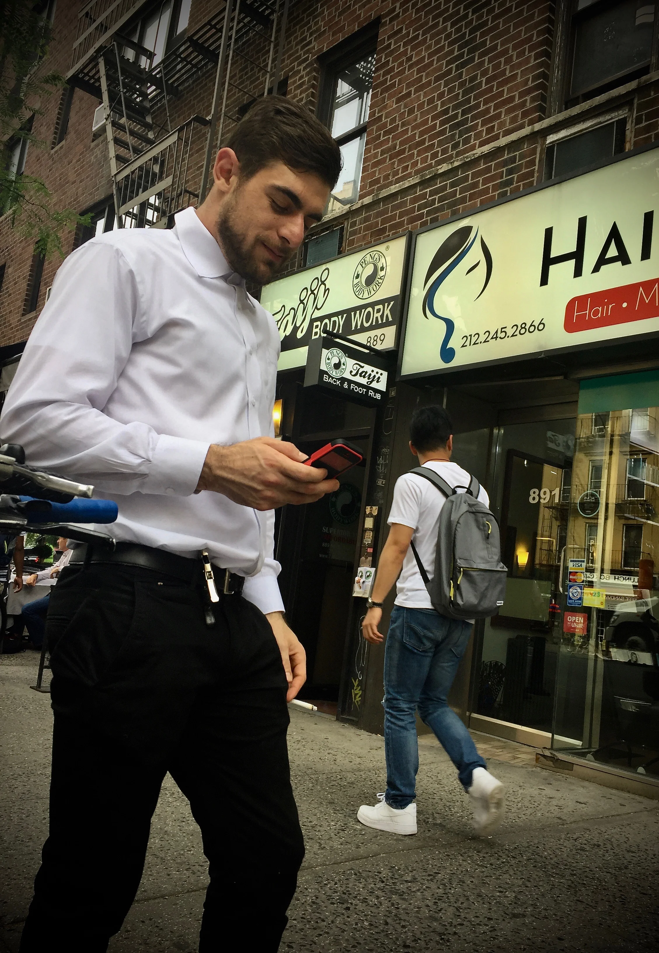 A Break from Opening Wine Bottles for a Waiter in Midtown