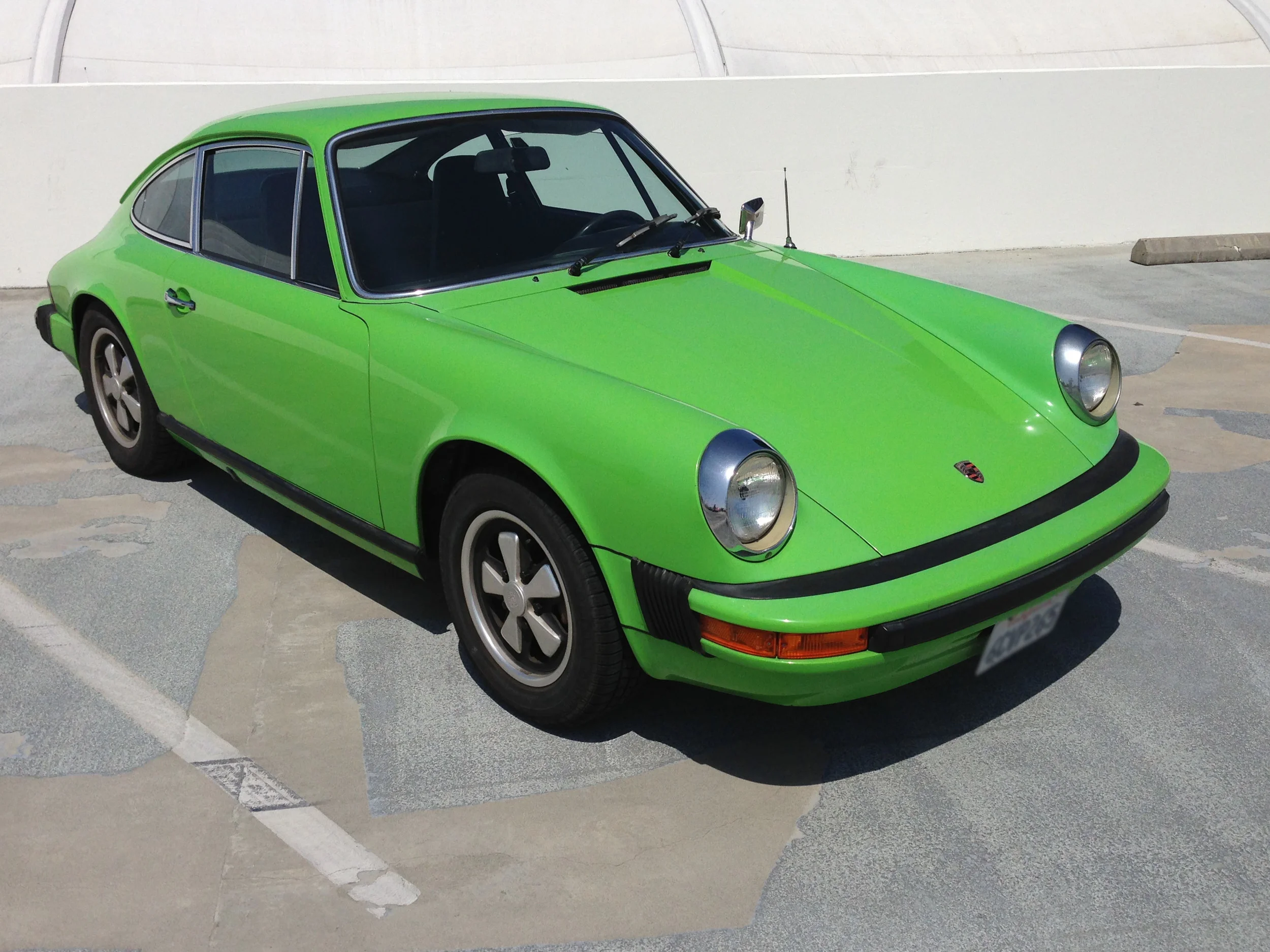 Non-metallic red, orange and green were signature colors for Porsche in the 70s like these classic 911's 