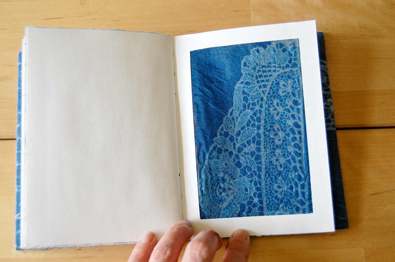  ​cyanotype of victorian lace on silk. 