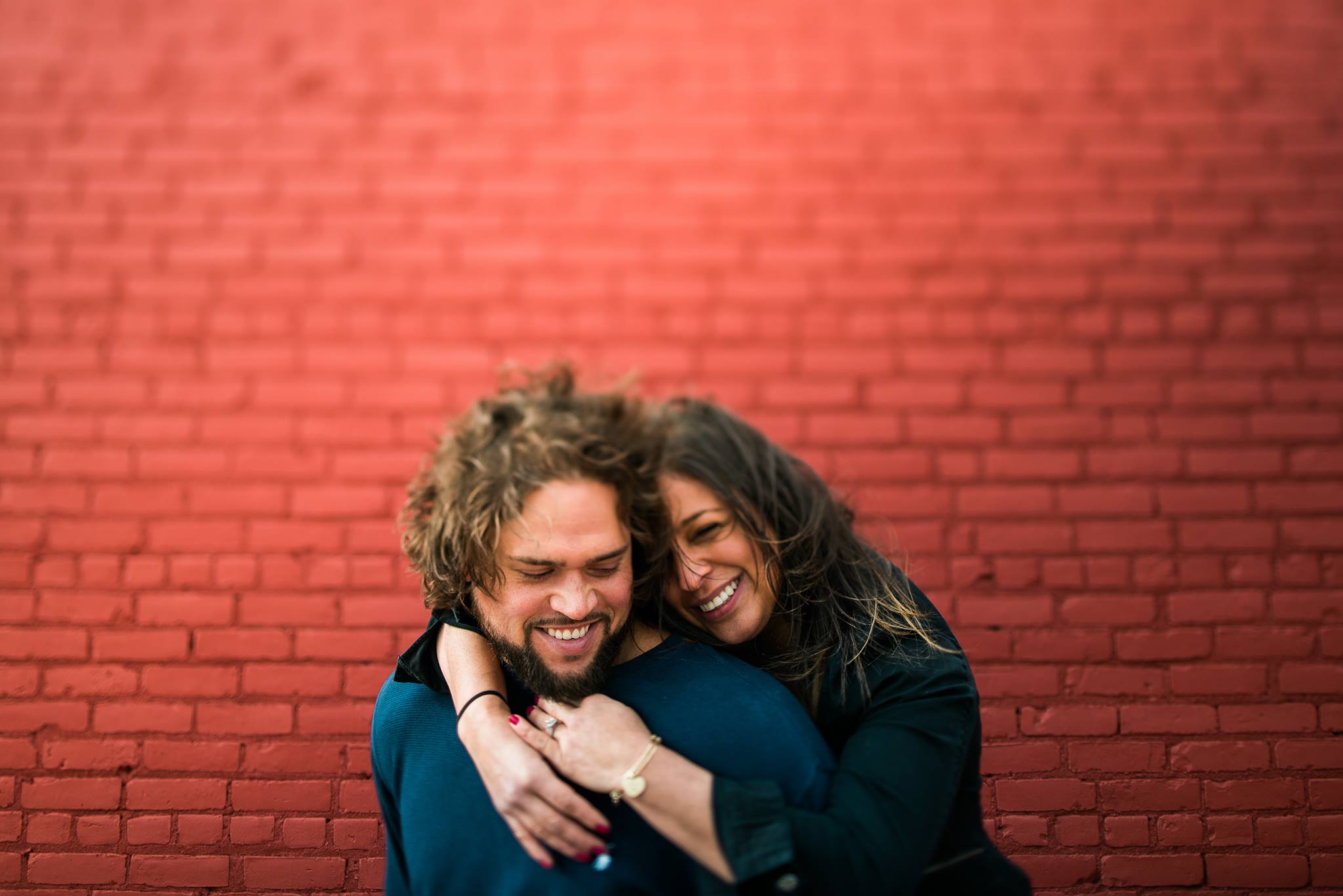 These are always easy. Just a random abandoned building in Detroit, MI. The canvas does not need to be vast or pretty, what makes this image is their chemistry and sweetness towards each other. There is a dumpster directly to the right of us. It may actually be what is causing the shadow in that bottom corner. I saw this red building while driving to the couples chosen location, and had them stop there with me on the way home. 