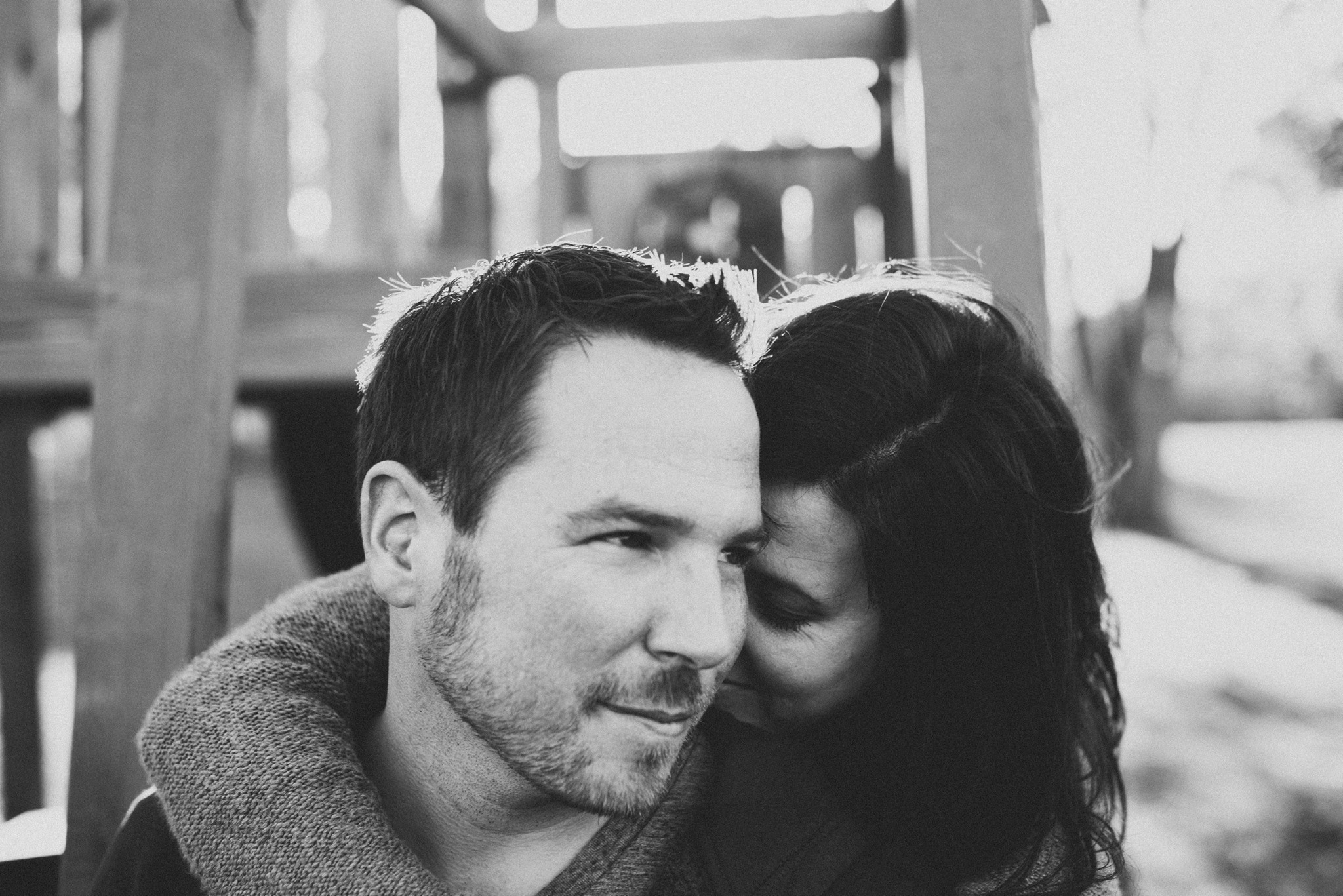 This is from a family lifestyle session I did recently. We are in their backyard, leaning on the monkey bars of their children's playscape. Underneath them is a sandbox and right next to me is a 12 month old trying to climb a slide. 