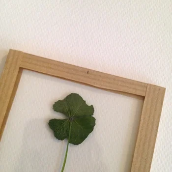 6 - On the back of the frame, mark a spot in the middle.