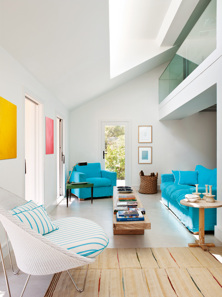 A colorful renovation by the seaside in Mallorca, via Nuevo Estilo . Loving the bright turquoise linen couch !