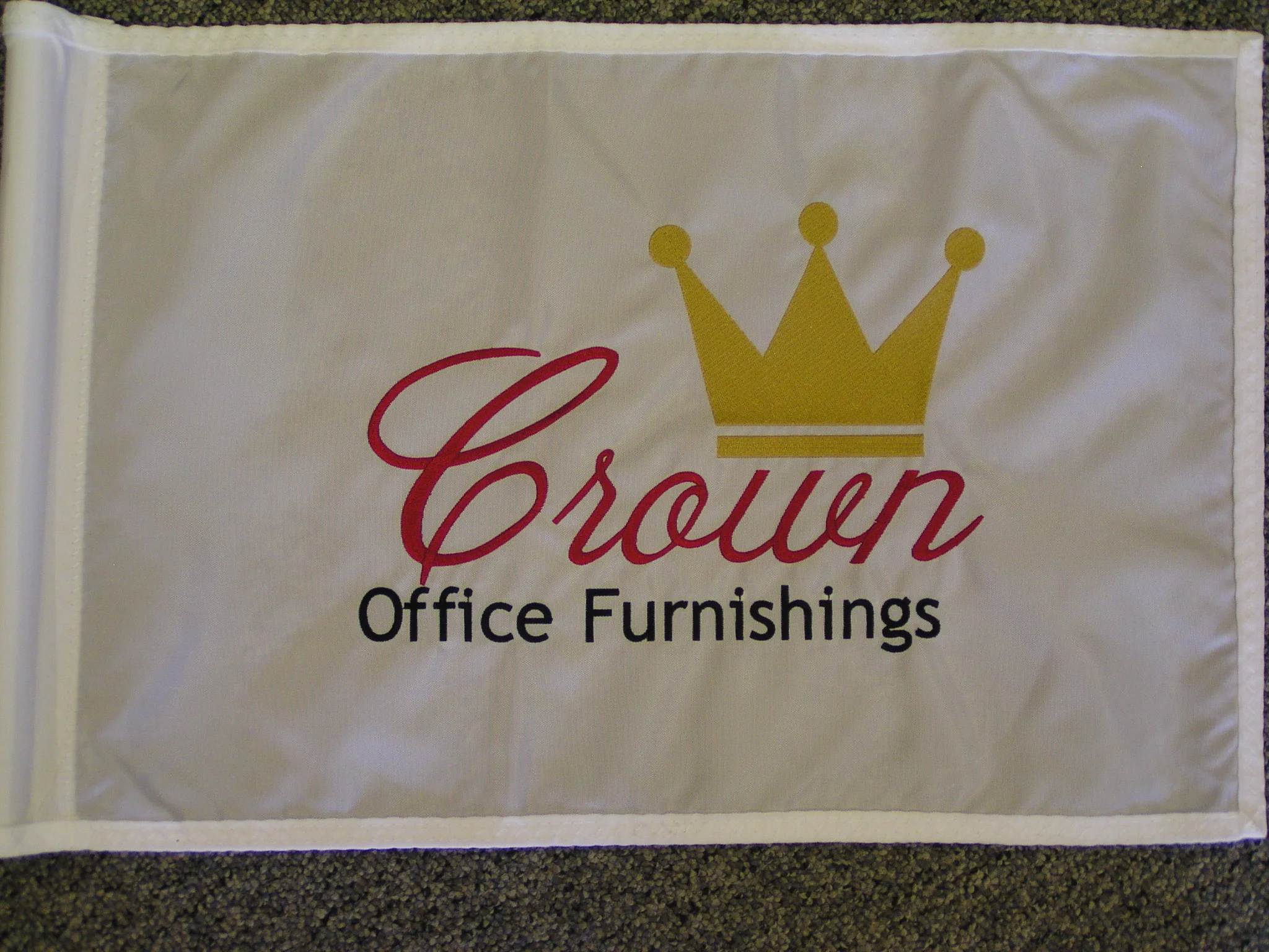 Embroidered logo on golf flag.
