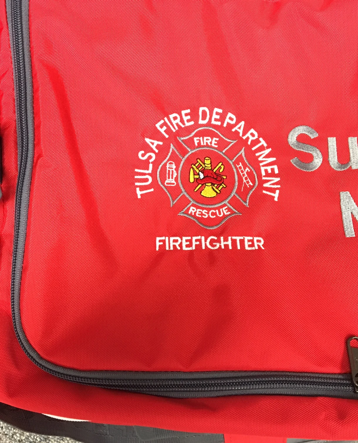 TFD logo on duffel bag.