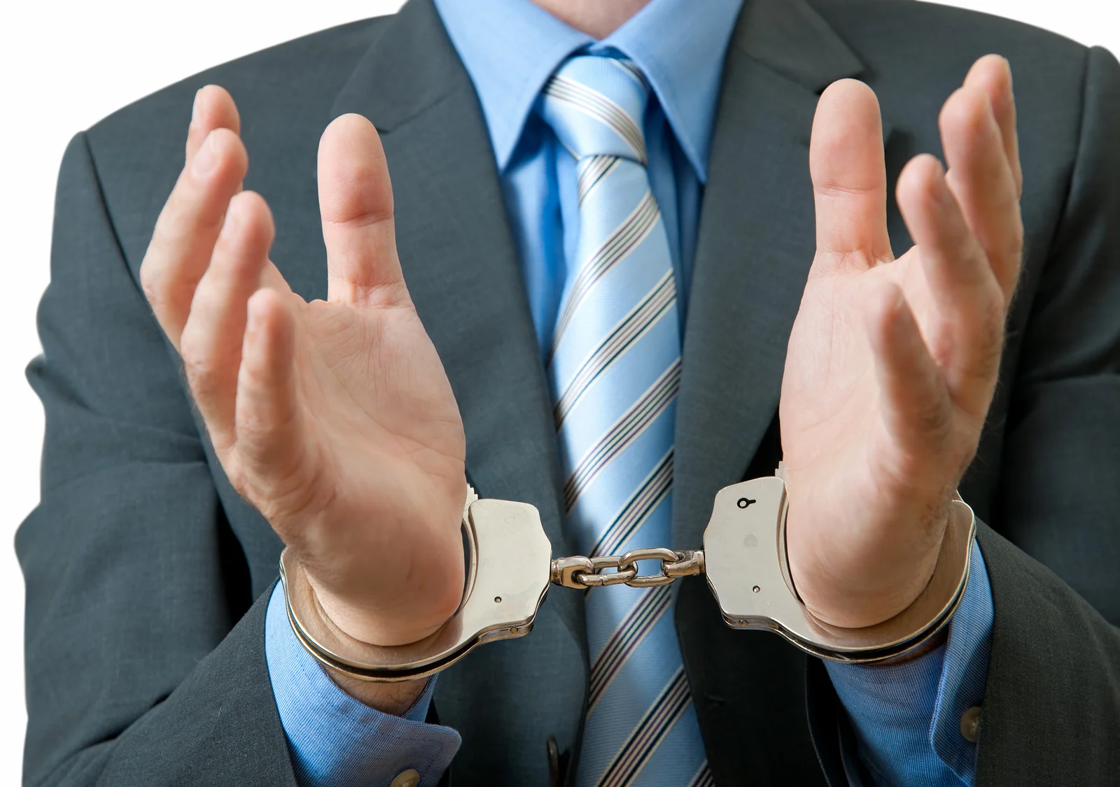 A customer service employee with hands in handcuffs to signify that he is unable to do anything to help customers.