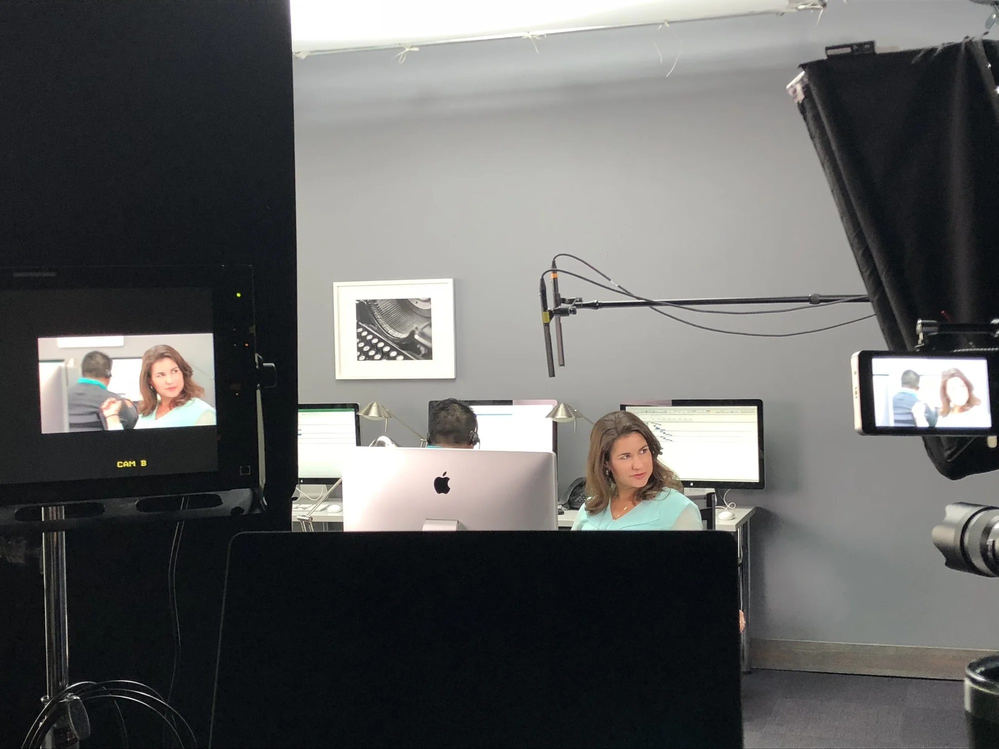 Filming a customer service training video on a contact center set.