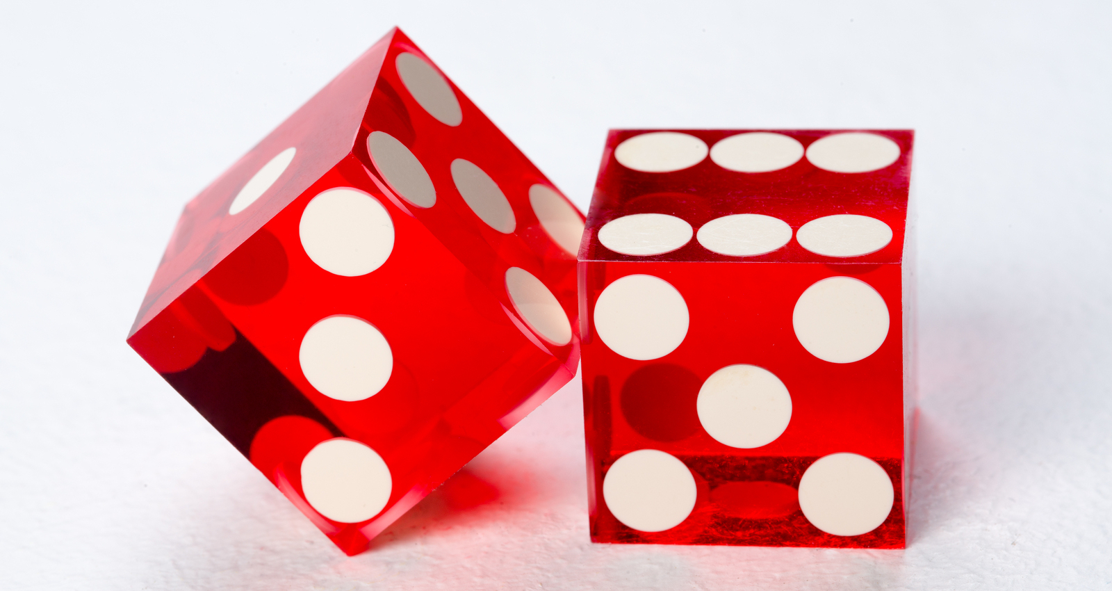 A pair of red dice, signifying random chance.