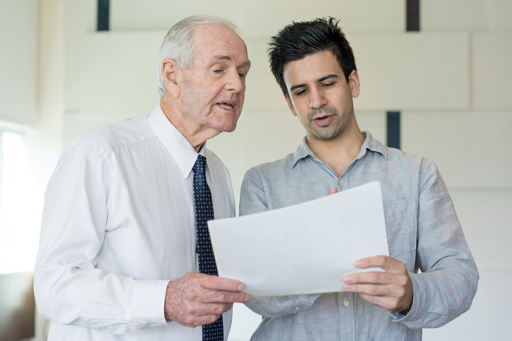 A senior leader mentoring an employee.