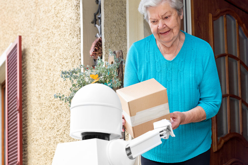 A robot delivering a package to a customer.