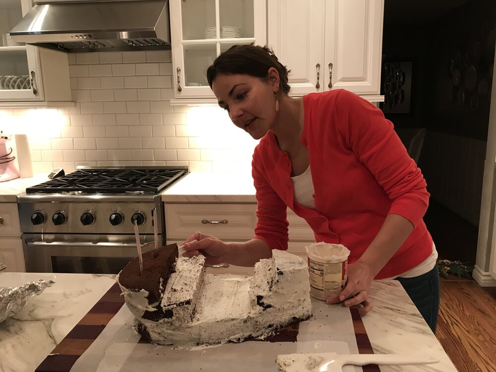 Sarah Levine baking a pirate ship birthday cake.