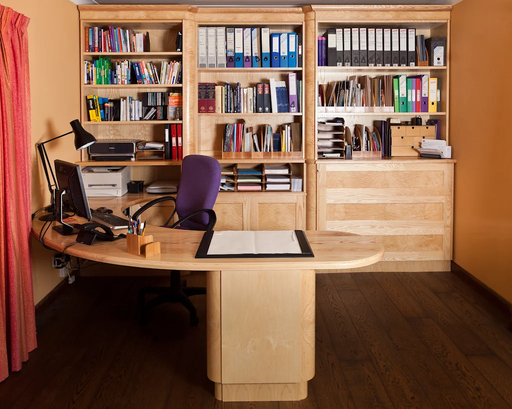 Custom designed and built home office in Ash with Burr Ash panels and pillars.