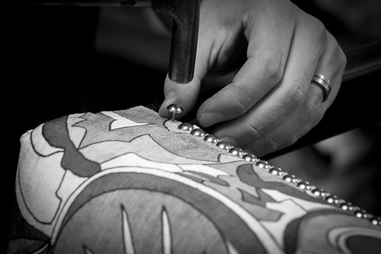 Each decorative nail is meticulously hand finished