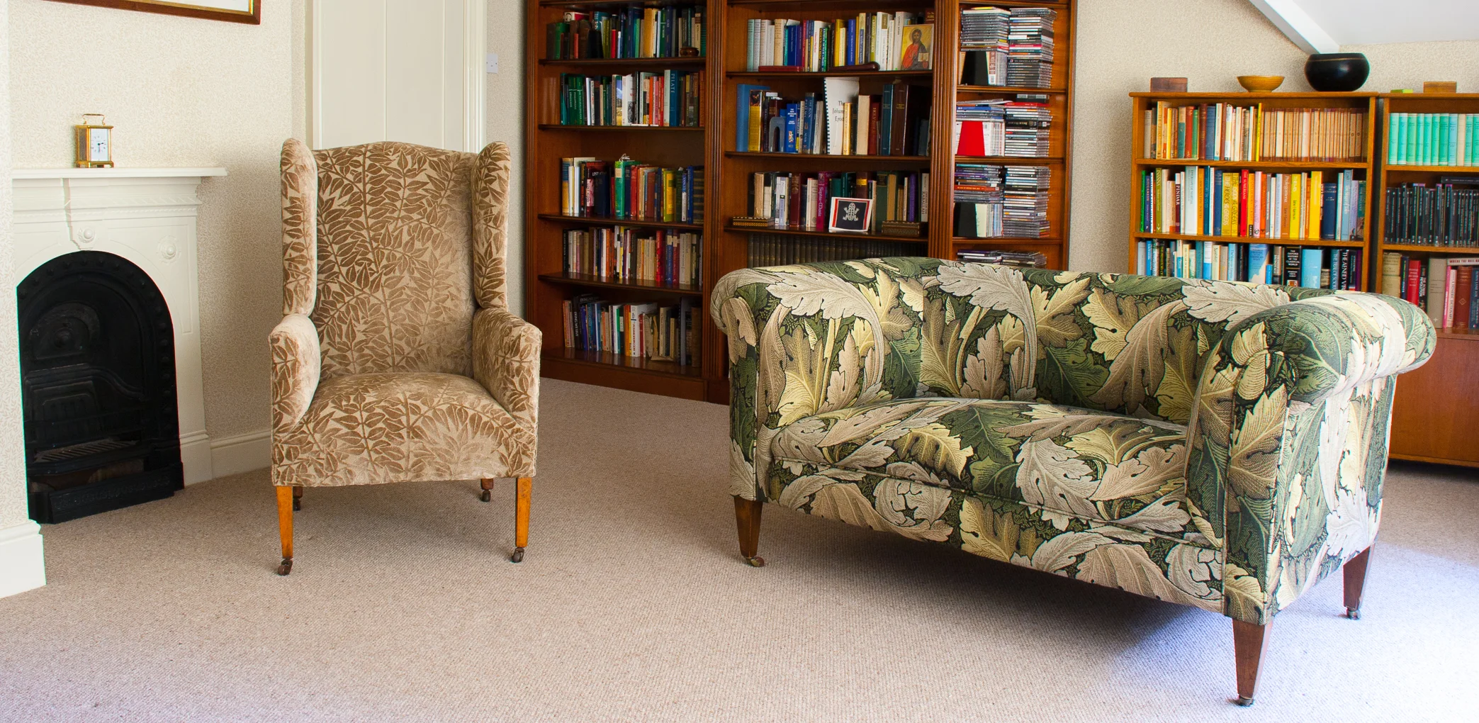 Edwardian drop arm sofa upholstered in William Morris Acanthus tapestry and Georgian wing chair in classic William Morris velour. It goes to show that you can use more than one pattern on different pieces within the same room.