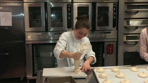 me, in class, piping gluten-free kaiser rolls!