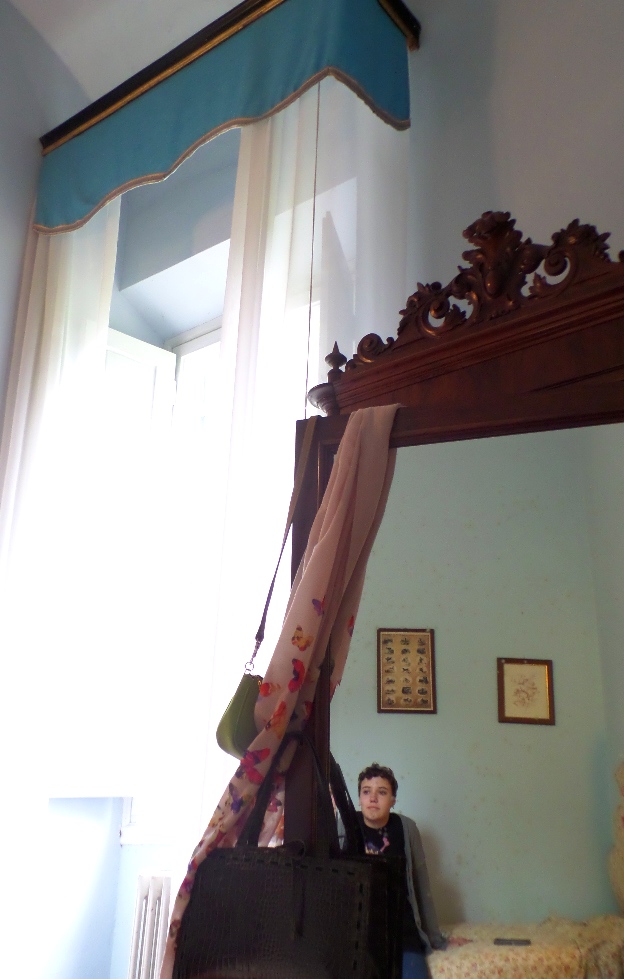 Sloane's reflection in the armoire.