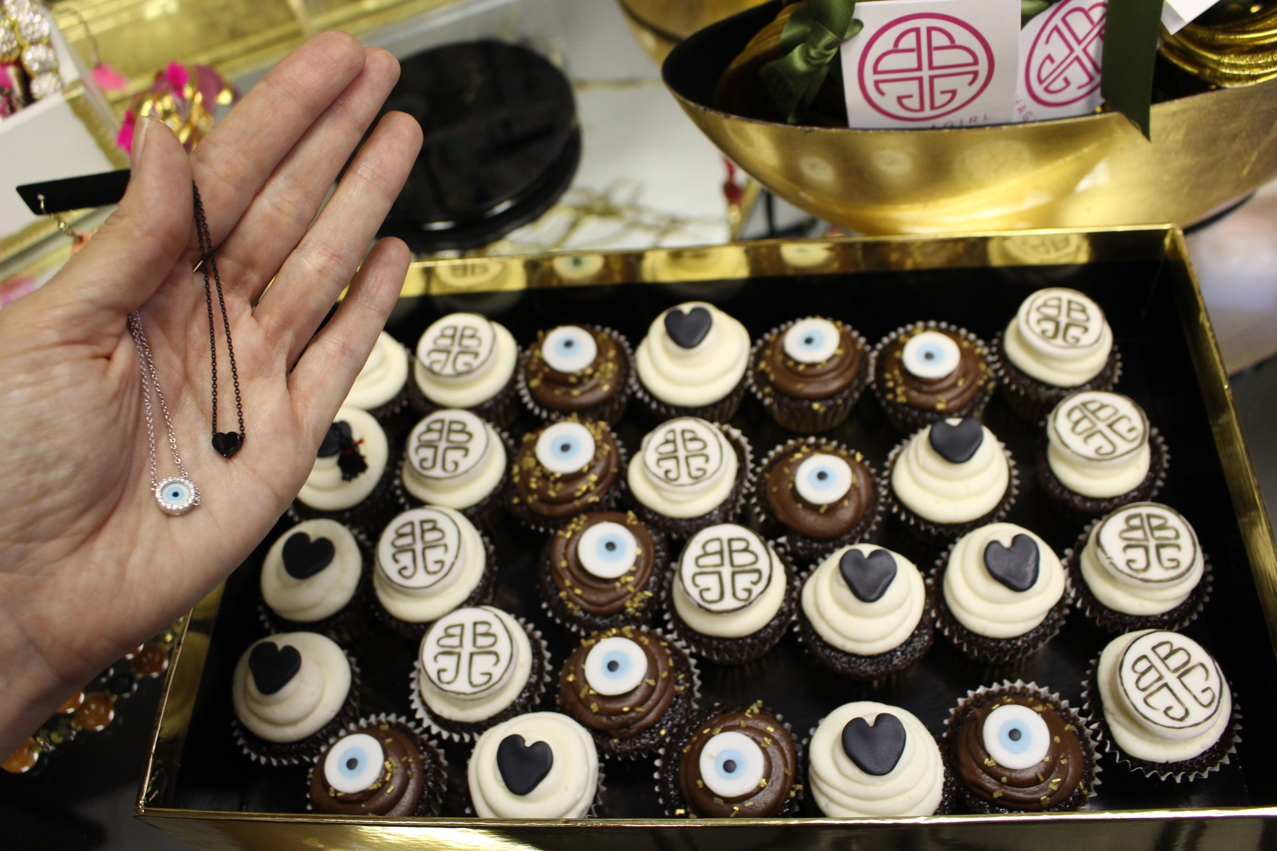 Mini cupcakes decorated with designs inspired by the latest BuDhaGirl pieces, the Evil Eye Wristlette and the Lava Heart Necklace .