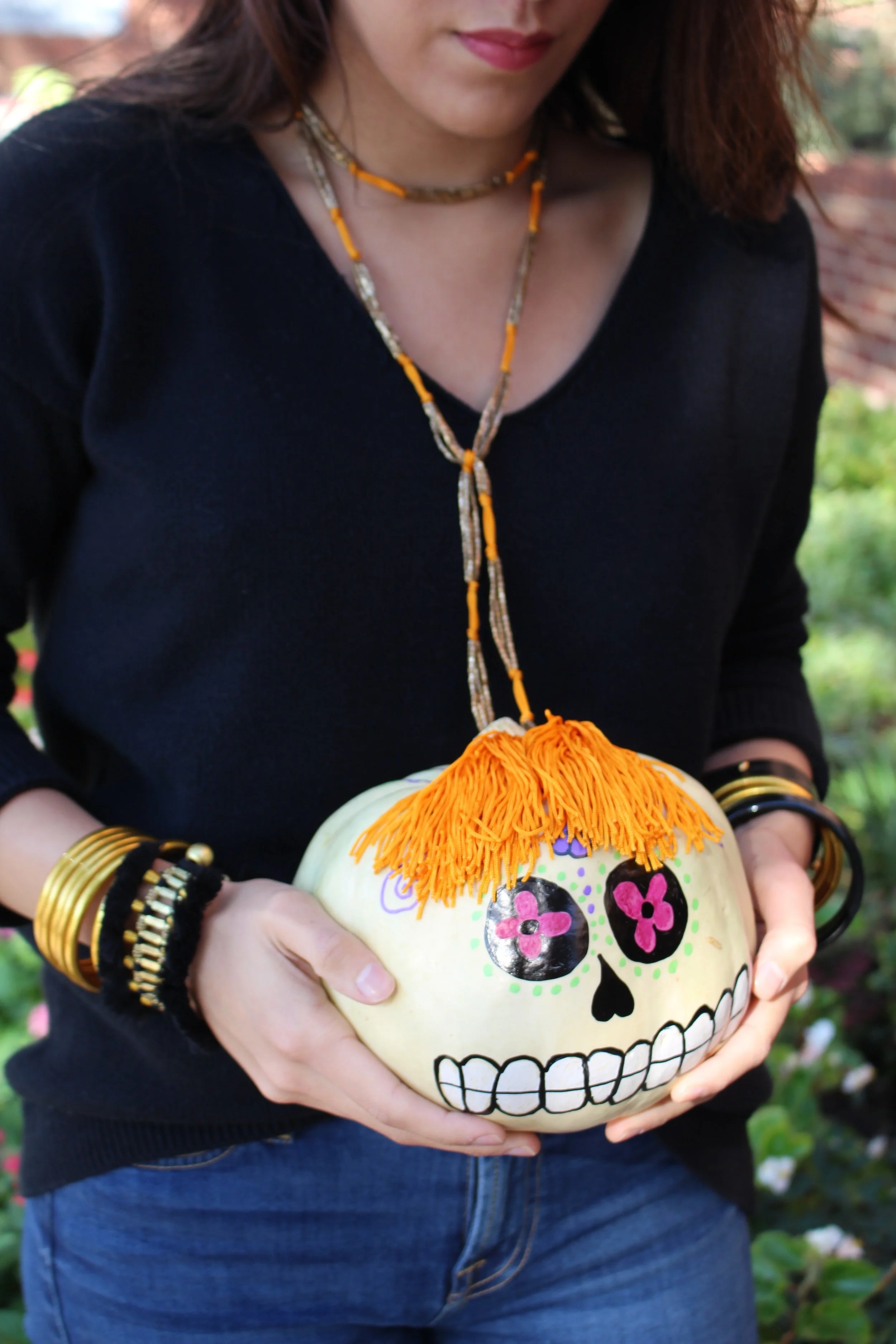 Day of the Dead pumpkin - an Always Lariat adds a very full head of hair to the decorative gourd. 