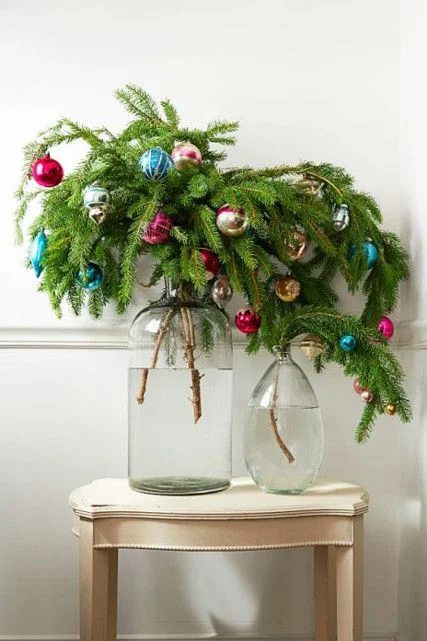 Want to decorate a lonely corner? Try a few branches embellished with ornaments!