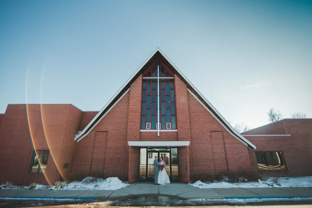 bride and groom infront of church.jpeg