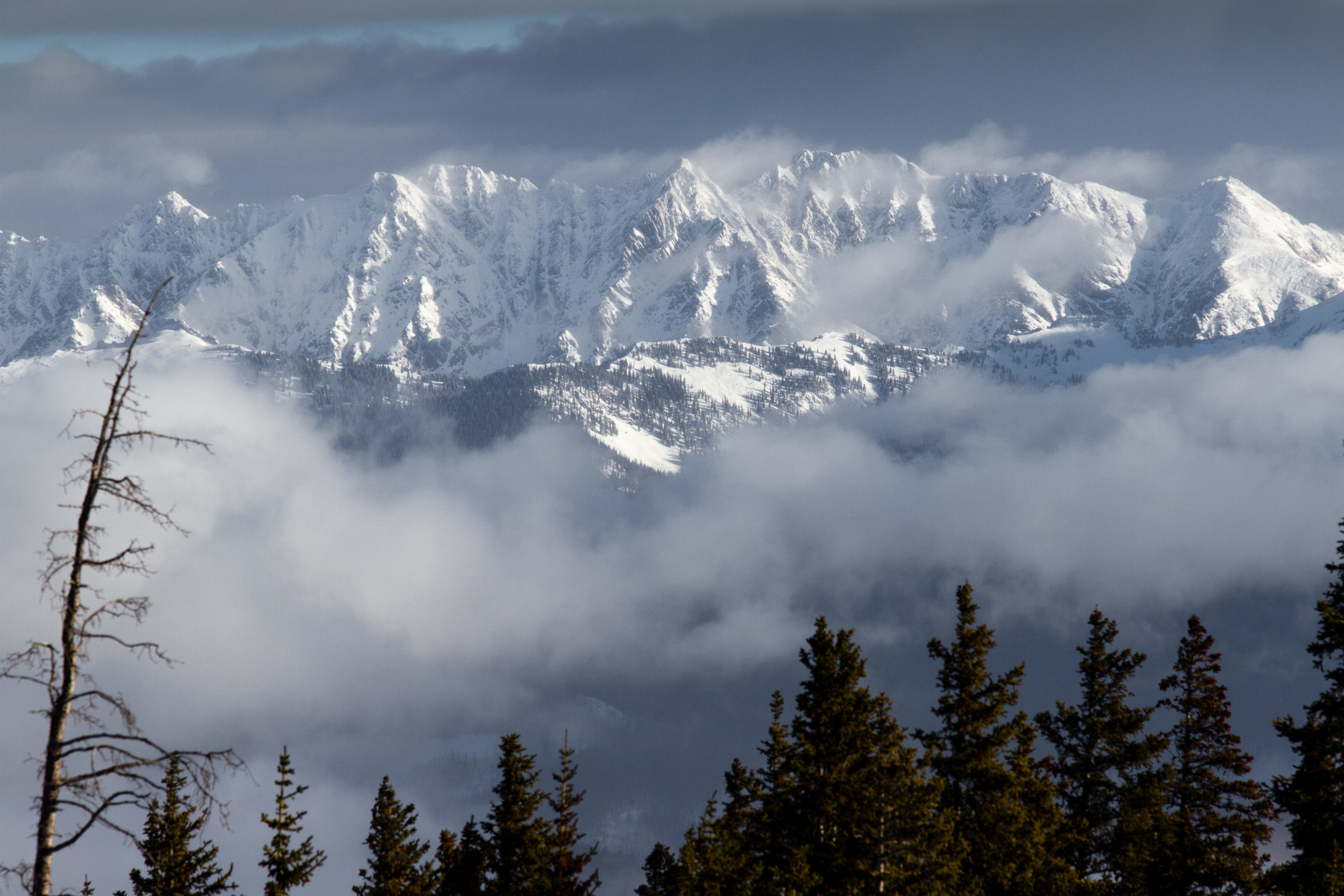  The Gore Range shining through the clouds as seen from Beaver Creek during the Birds of Prey ski races. 5, December 2014 