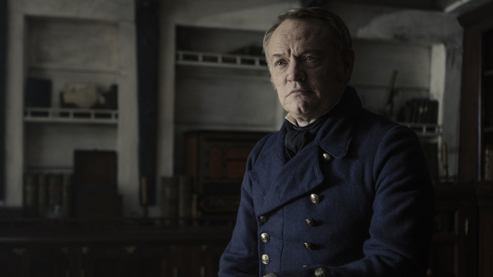 Jared Harris is given the thankless role of the doomed leader of men