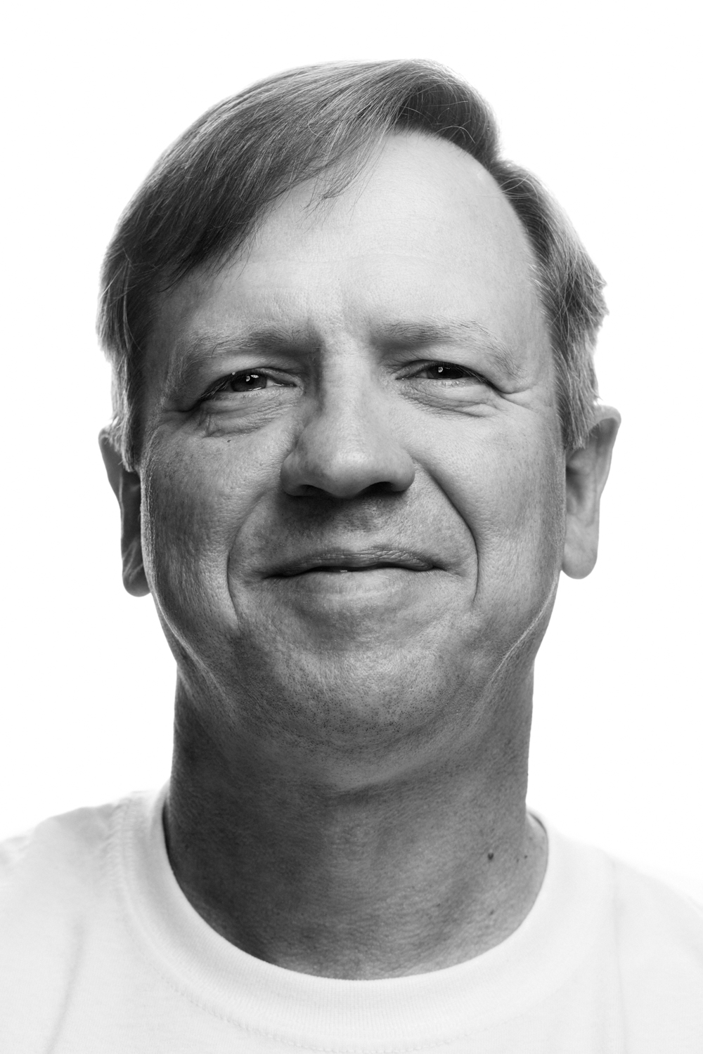 Man on white background, studio photography, black and white portraits