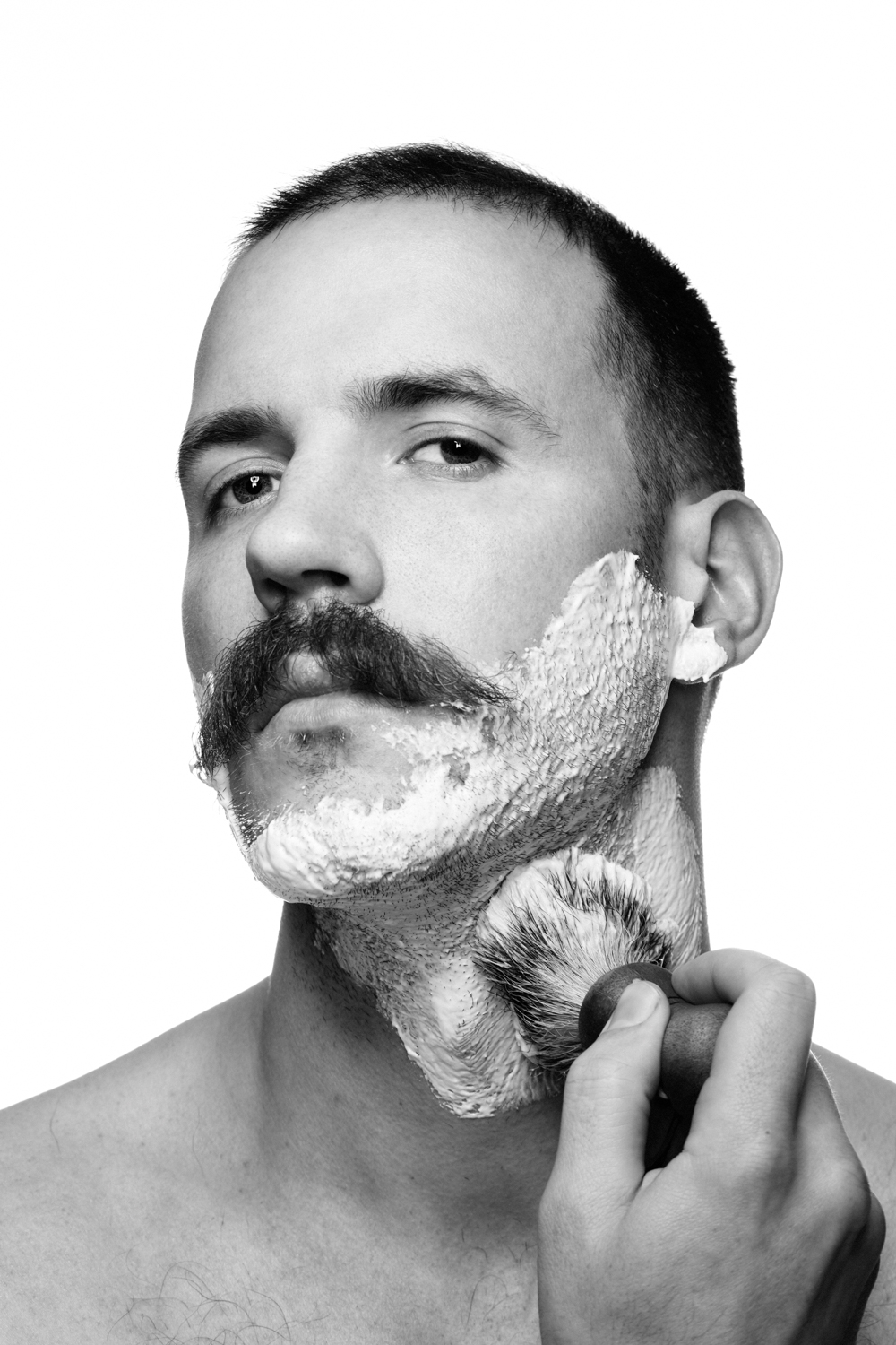 Man on white background, studio photography, black and white portraits, man shaving