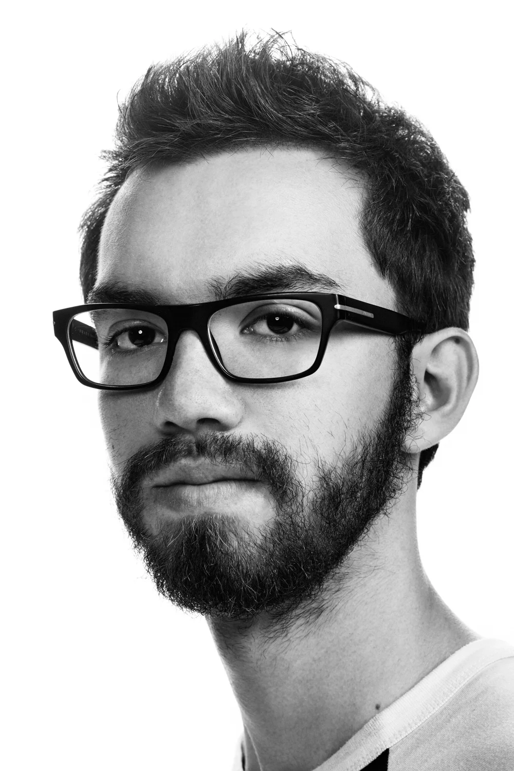 Man on white background, studio photography, black and white portraits, hipster with glasess