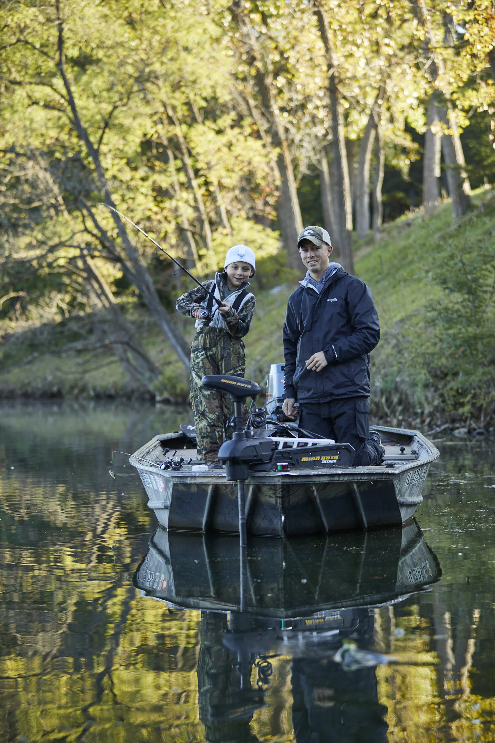  Father and son fishing from a boat 