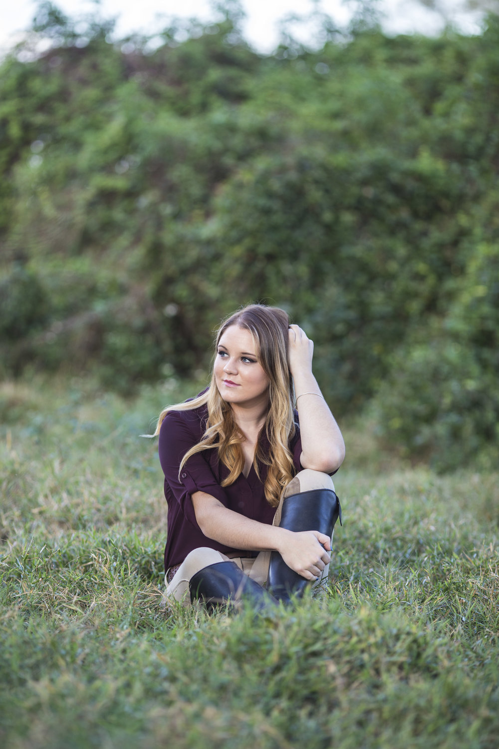 Young girl sitting in the field