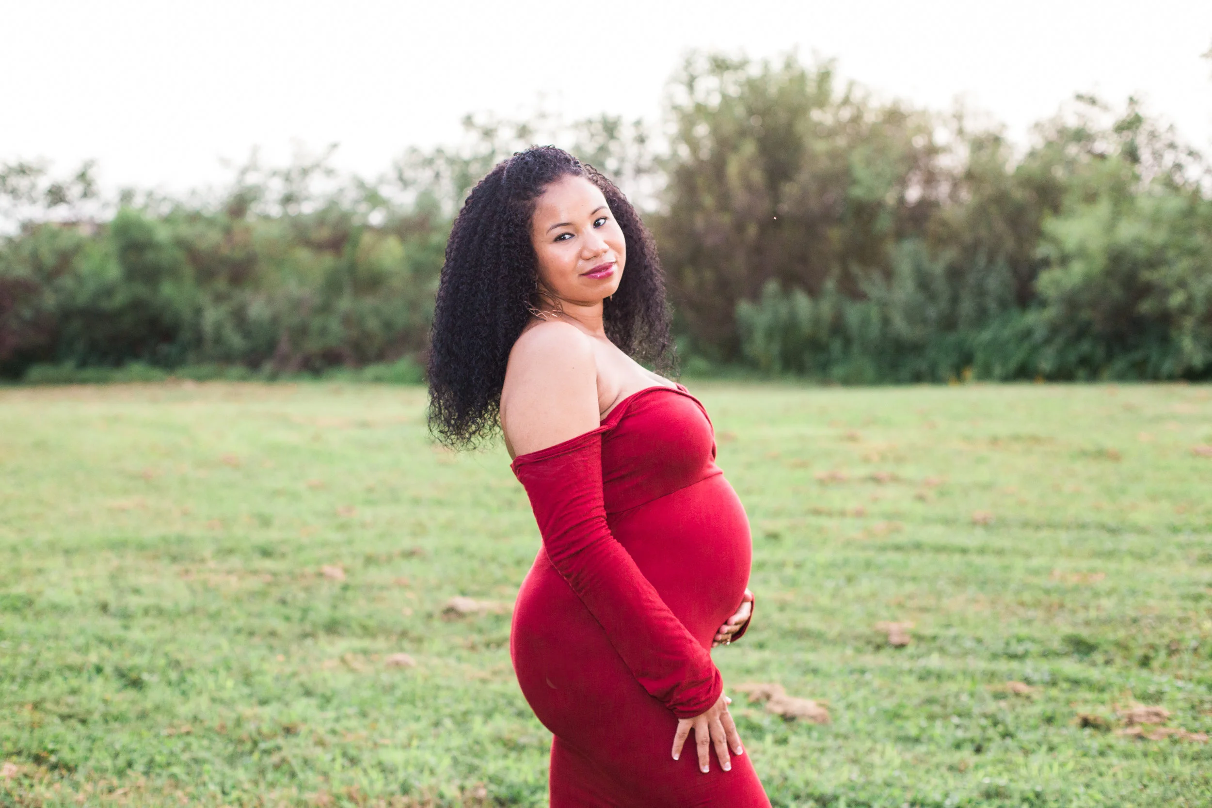 beautiful mother wearing a red dress in lake seminole