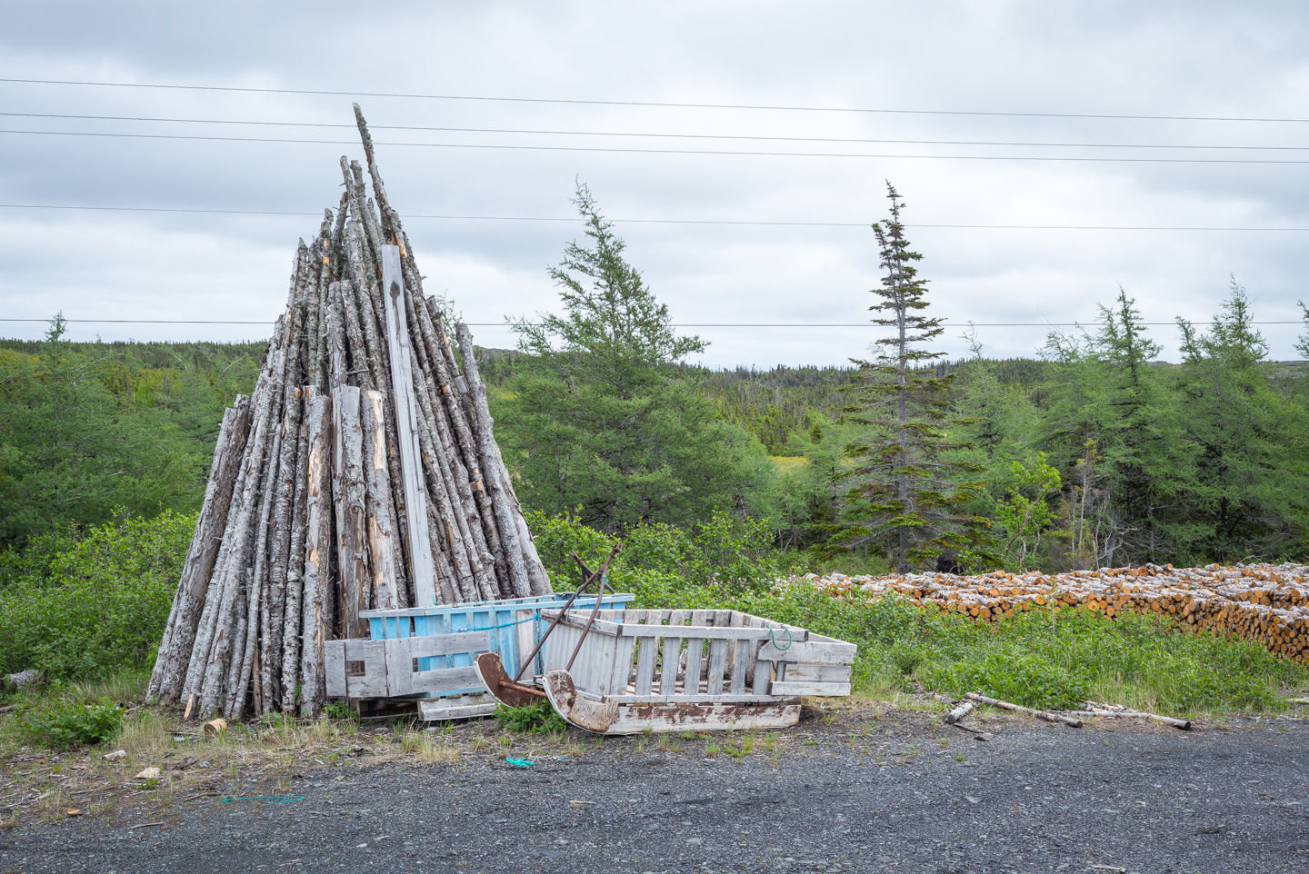 Timber and sleds at the firewood depot. Saint Lunaire-Griquet, Newfoundland 2016