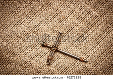 stock-photo-a-cross-with-nails-on-canvas-background-76273225.jpg
