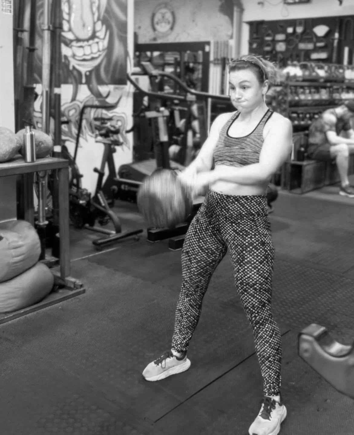 Lydia swinging a 44kg kettlebell during a strength training session