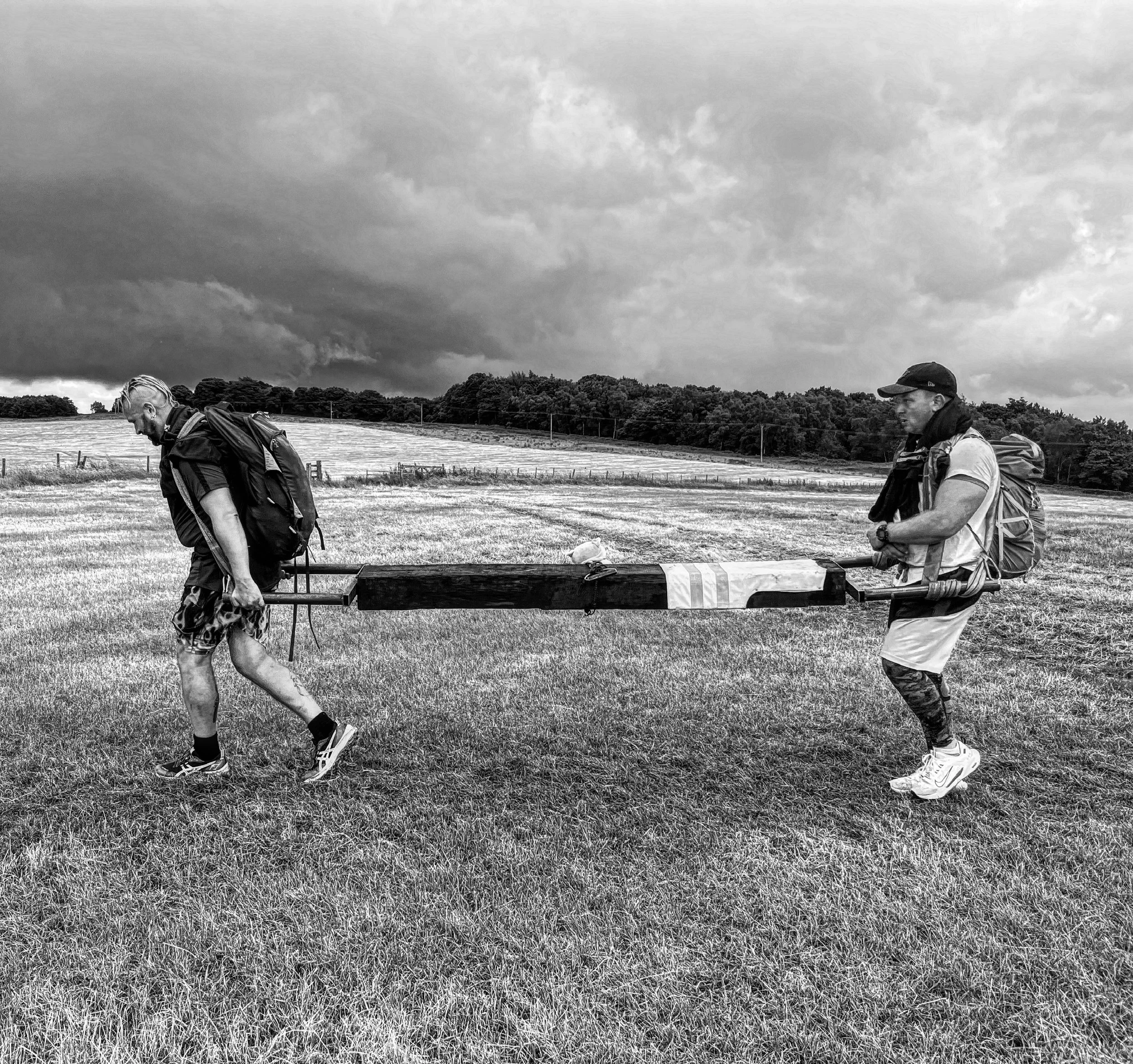 Charlie and Ben on an ultra-with a 80kg log!