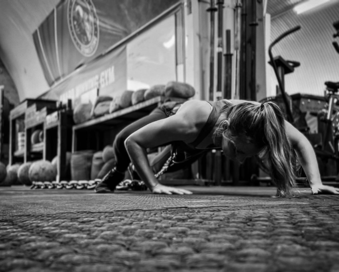 Gillian dragging heavy chains during strength training at the Commando Temple in Deptford