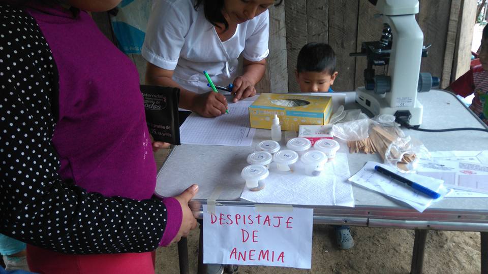 Little Elian watching the nurses do the feces testing! Do you think we have a future medical professional in the making?
