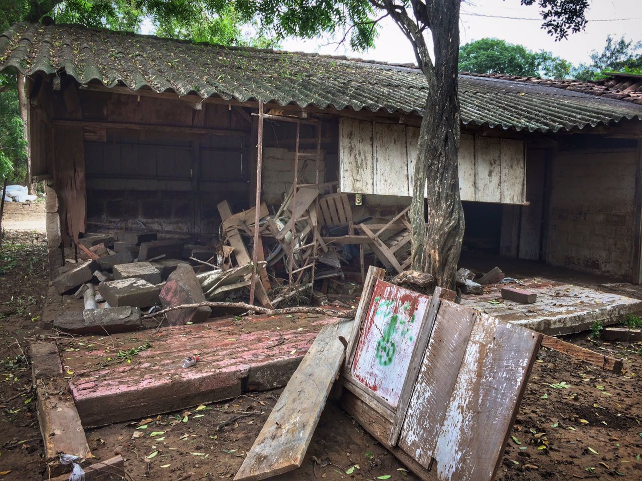 This house lost walls due to the strong currents of the flood. As you can see, most of the belongings got swept away as well.