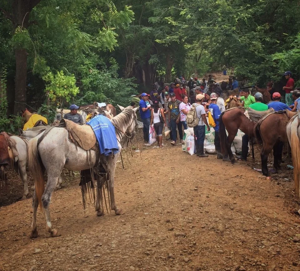 This group includes one member of every family in the community of El Sanchez who came down almost 3 hours on horse to load up their daily supply of food and materials.