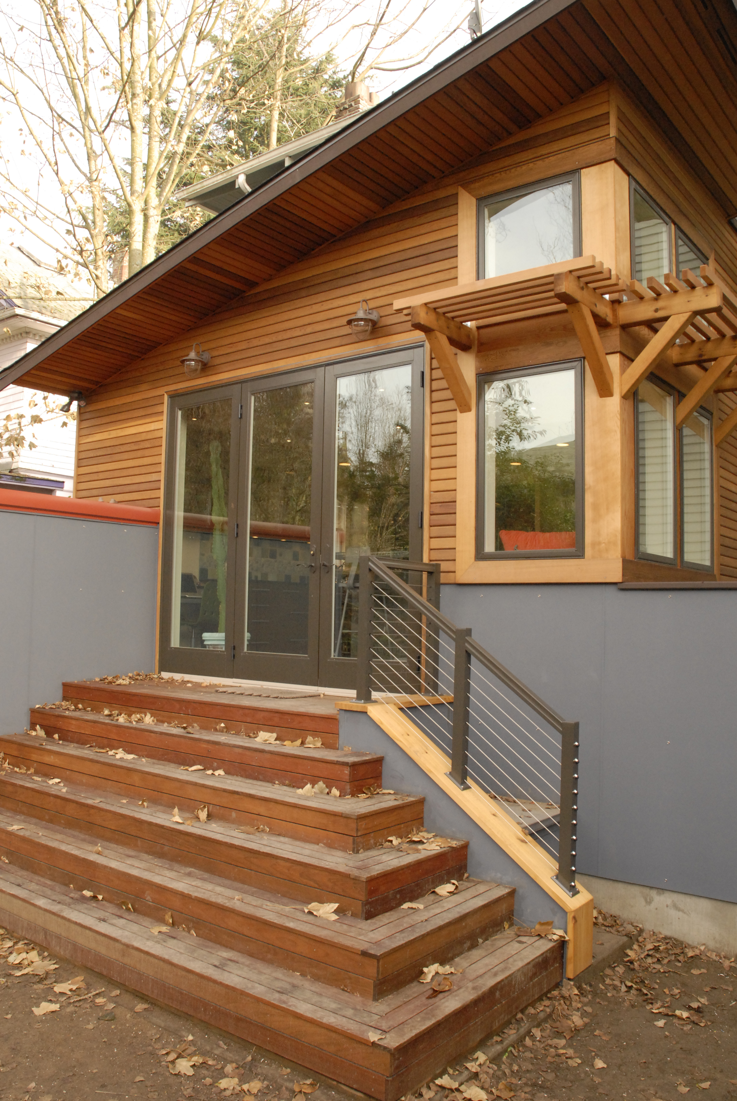 Exterior is dramatic in style using eco-friendly cedar and natural finish