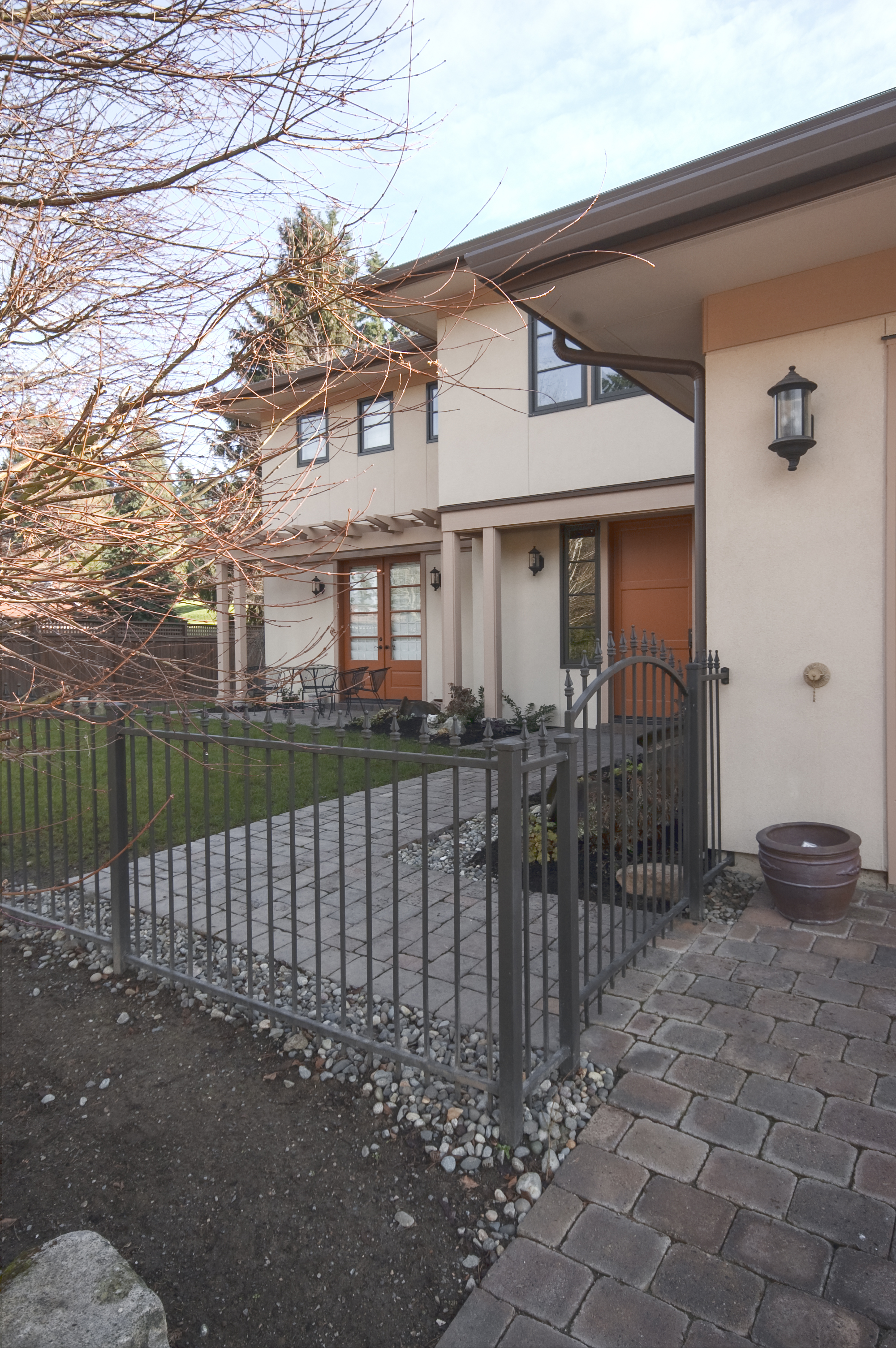 Original custom iron fence was modified and added onto to fit the new yard configuration.