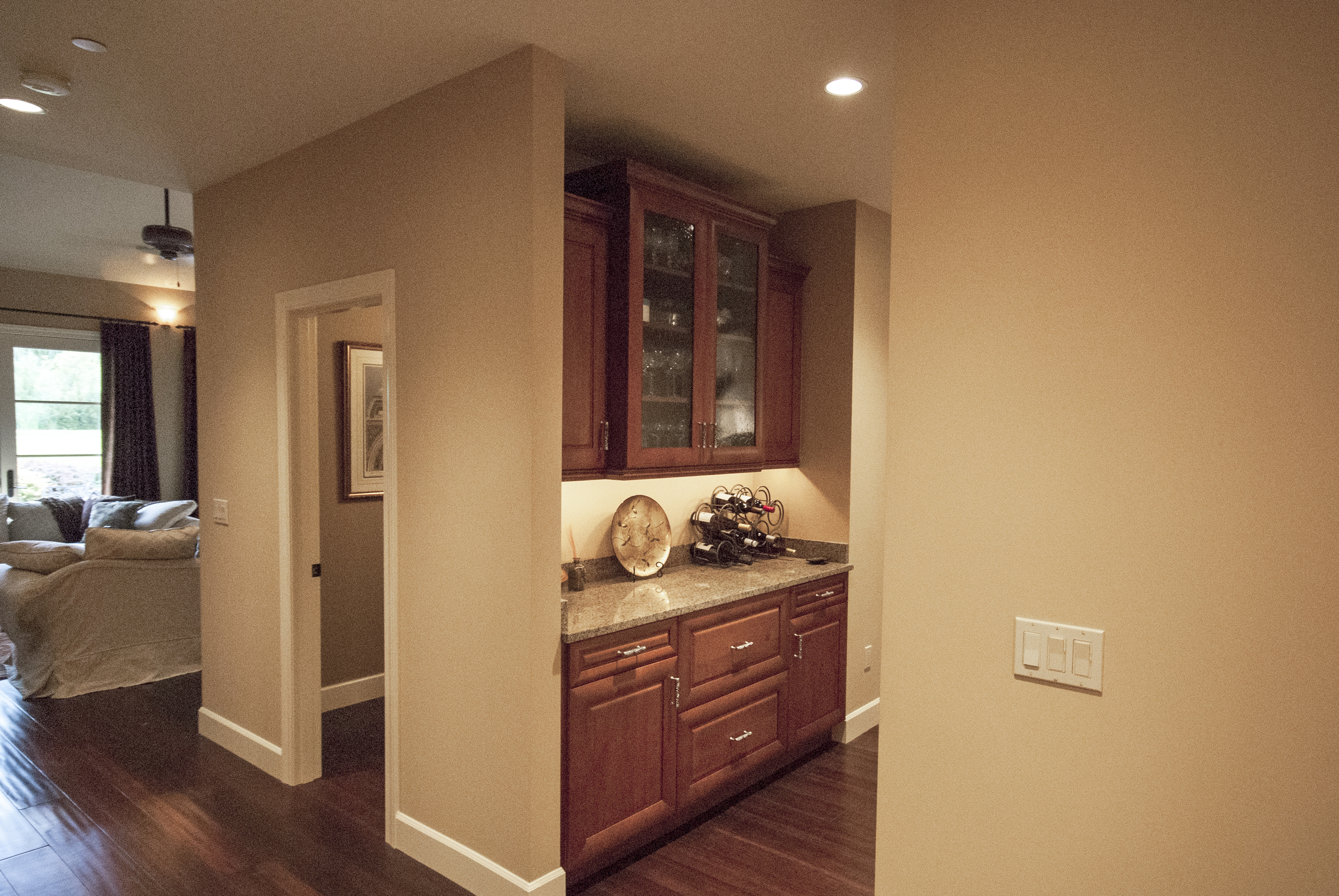 A custom butlers pantry for storing and serving liquor is also a favorite hang-out as guests wait for their drinks.