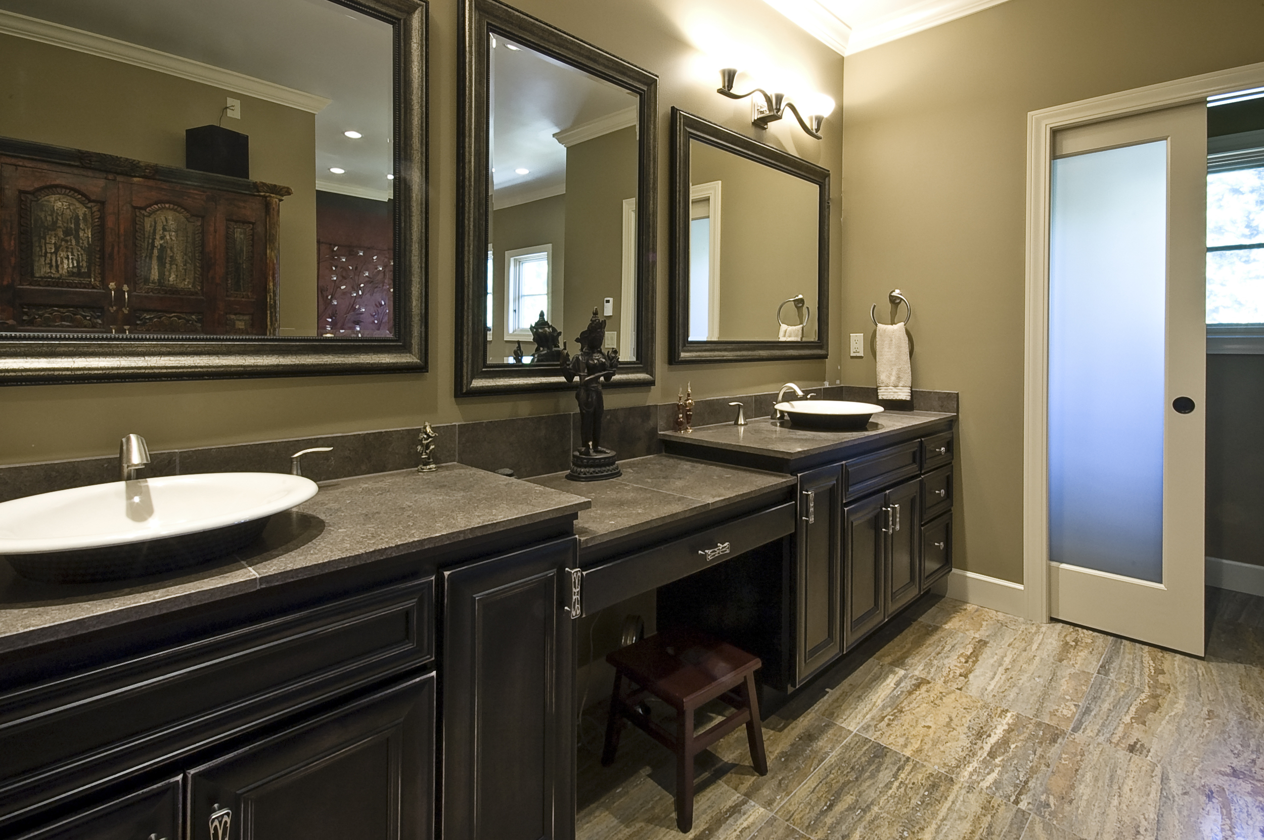 The master bath suite is a very personal place. Heated floors, his and hers vanities, a make up table and glass doors on the water closet and entry - are just a few things that make this so special.