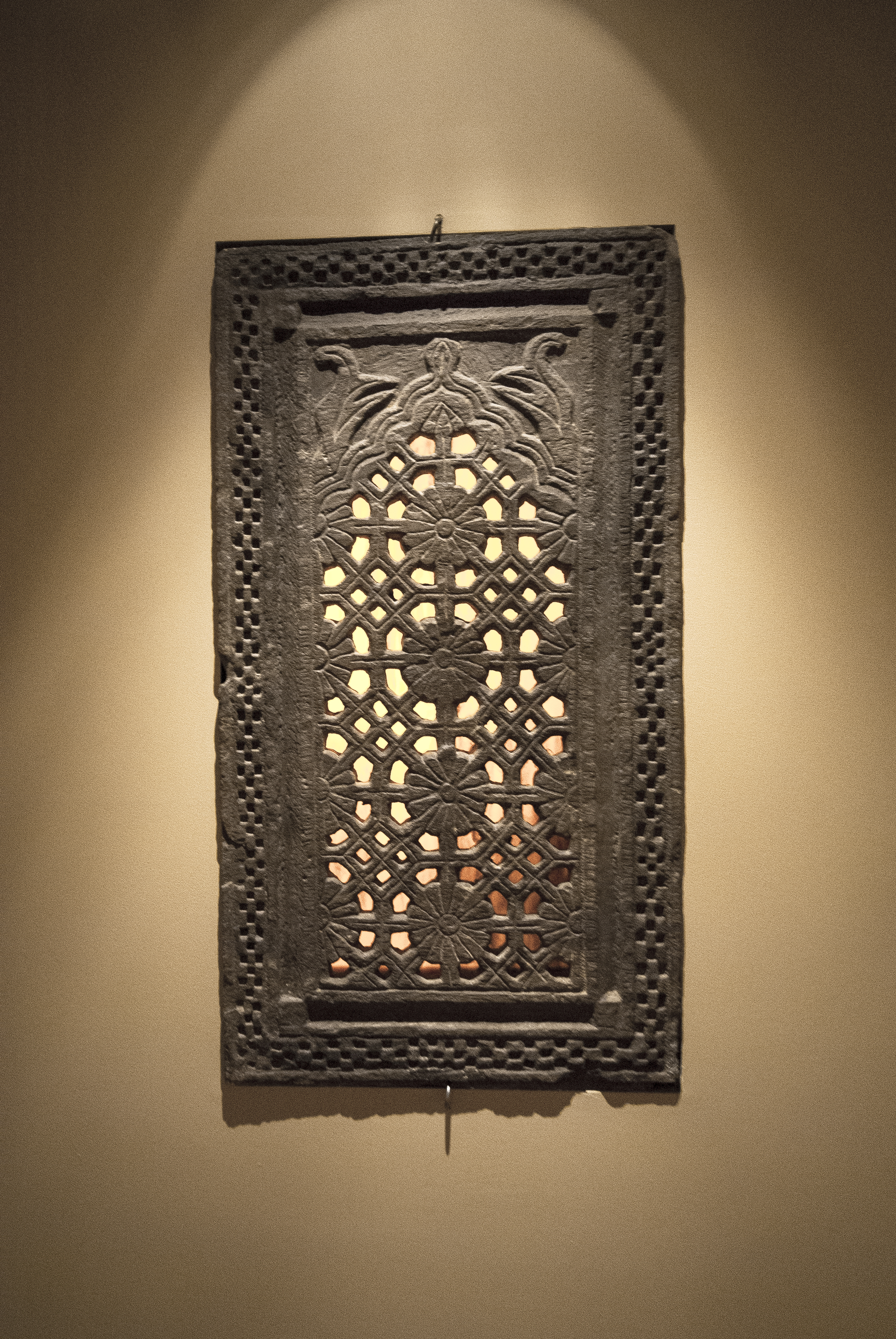 The "temple window nook" houses an 800 year old window from a Hindu temple.  The window is recessed into the wall and back lit by a Lexan plastic panel.
