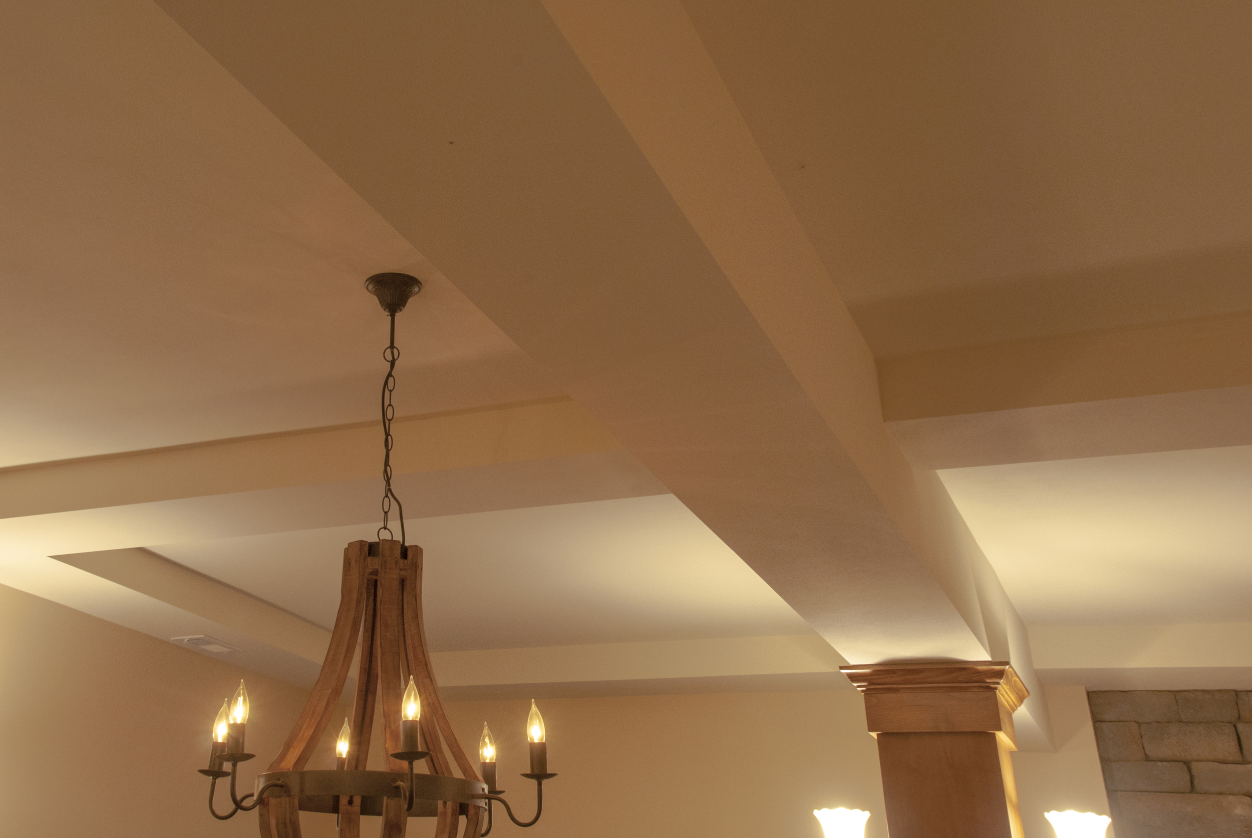  A coffered ceiling both hides the structural beams and adds drama to the 10' ceilings. 
