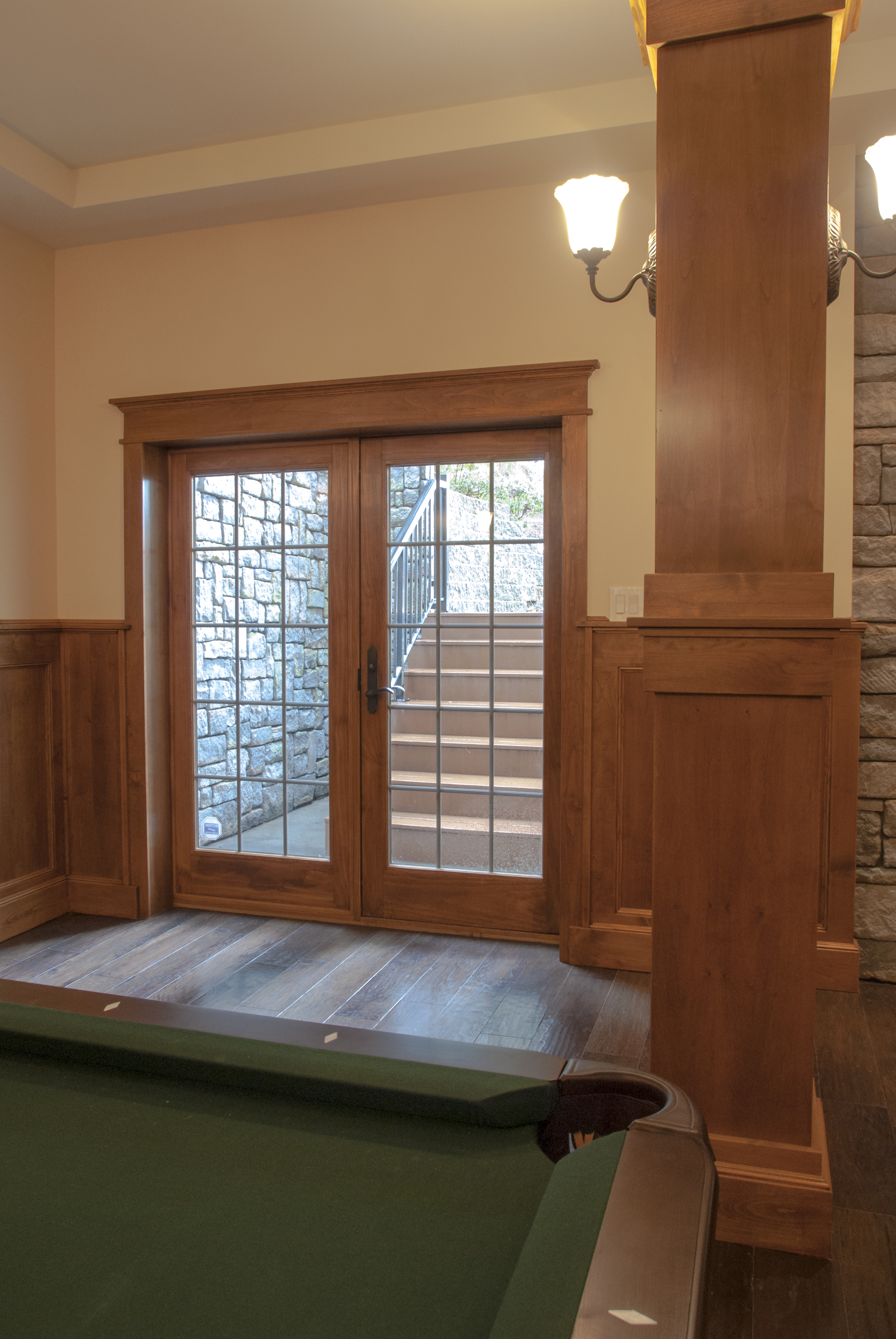  Beautiful wood clad interior and aluminum exterior French doors let natural light in and serve as the welcoming exterior entry. 